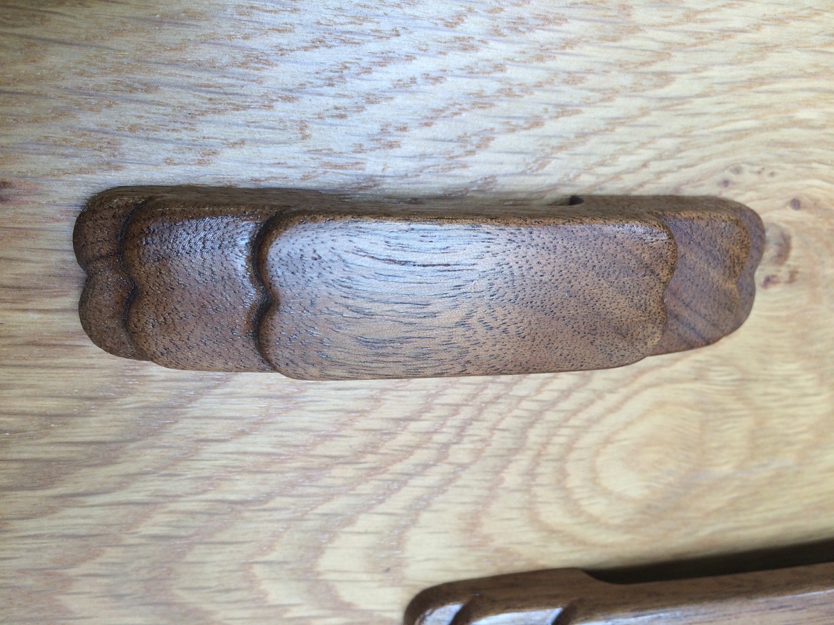 Layered style 4 inch drawer pull in finished walnut thumb